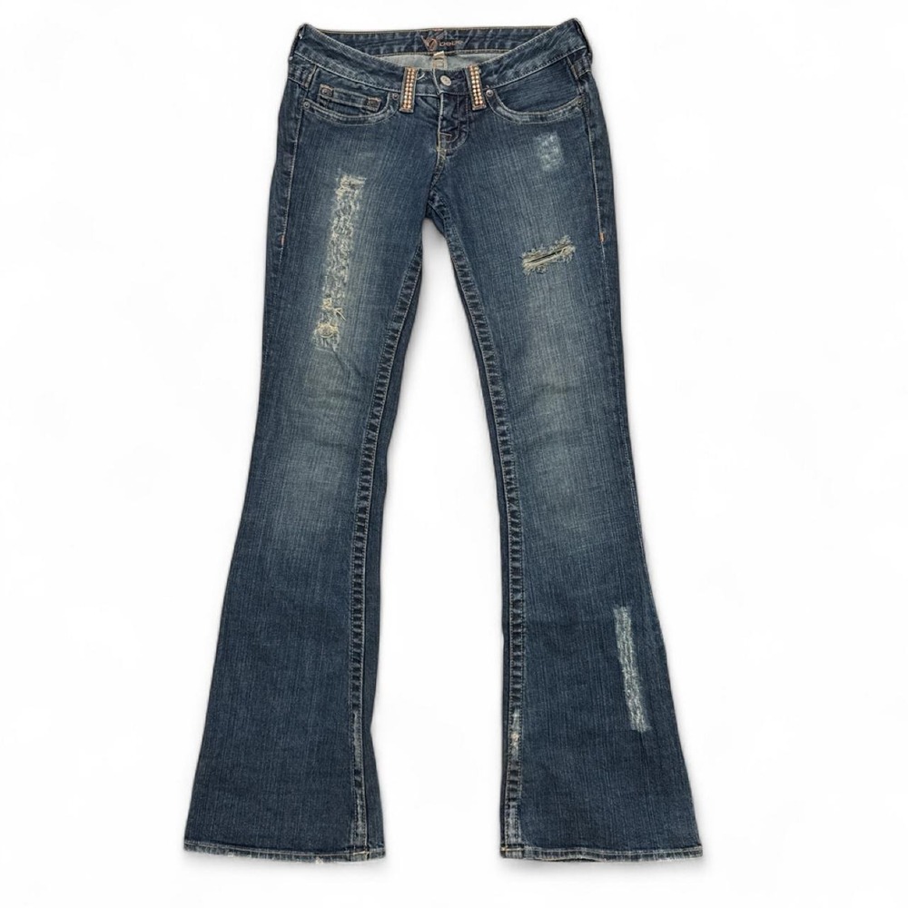 Bebe Rhinestone Low rise flare jeans with distressed details